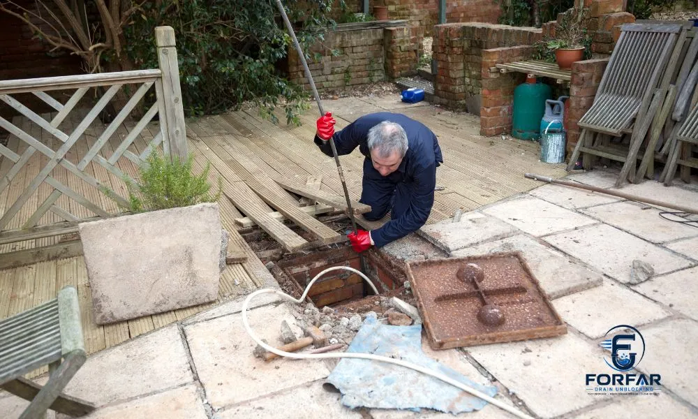 Professional emergency drain unblocking service in Forfar showing high-pressure water jetting clearing a severely blocked drain